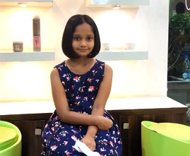 Young girl getting a stylish haircut at the salon
